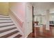 Basement staircase leading to a recreational bonus room with a pool table at 4480 Egret Ave, Cumming, GA 30041