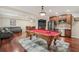 Finished basement featuring a pool table, wet bar, and comfortable seating area at 4480 Egret Ave, Cumming, GA 30041