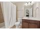 Bathroom with tub-shower combination, vanity, and tile flooring at 4480 Egret Ave, Cumming, GA 30041