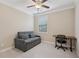 Bedroom featuring a sofa, desk, ceiling fan, and a window at 4480 Egret Ave, Cumming, GA 30041