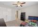 Bedroom featuring natural light from window, closet space, and a ceiling fan at 4480 Egret Ave, Cumming, GA 30041