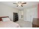 Bedroom has a closet and natural light from a window and ceiling fan at 4480 Egret Ave, Cumming, GA 30041
