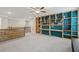 Upstairs bonus room featuring custom built-ins with desk, ceiling fan and ample storage at 4480 Egret Ave, Cumming, GA 30041