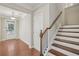 Bright entryway featuring hardwood floors, stairs, and natural light at 4480 Egret Ave, Cumming, GA 30041