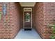 A welcoming front door with brick surround and visible house number at 4480 Egret Ave, Cumming, GA 30041