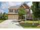 Charming brick-front home with a well-manicured lawn and two-car garage at 4480 Egret Ave, Cumming, GA 30041