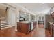 Open kitchen with a large central island connects to the living and dining areas in the house at 4480 Egret Ave, Cumming, GA 30041