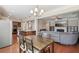 Open floor plan showcases a seamless flow between the dining area, kitchen, and living room at 4480 Egret Ave, Cumming, GA 30041