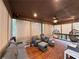 Relaxing screened patio with comfortable seating and hanging egg chairs at 4480 Egret Ave, Cumming, GA 30041