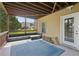 Covered patio with outdoor seating, a door to the house, and view of the backyard at 4480 Egret Ave, Cumming, GA 30041