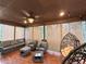 Relaxing covered patio with comfortable seating and hanging egg chairs at 4480 Egret Ave, Cumming, GA 30041