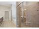 Large tiled shower with glass door and built in storage at 4480 Egret Ave, Cumming, GA 30041
