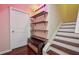 View of the staircase with overhead lighting and bonus room storage space at 4480 Egret Ave, Cumming, GA 30041