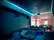 Theater room with plush seating, tiered platform and modern lighting system at 4480 Egret Ave, Cumming, GA 30041