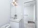 Upstairs bathroom with single vanity and neutral walls and countertop at 1346 Riverstone Rd # 107, Jonesboro, GA 30238