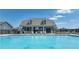 Community pool with lounge chairs for relaxing and socializing at 1346 Riverstone Rd # 107, Jonesboro, GA 30238