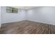 Finished basement featuring wood vinyl floors and a window looking out to trees at 2480 Washington Street Ext # 2482, Austell, GA 30106