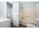 Bathroom featuring a vanity, toilet, and shower tub with blue walls and vinyl floors at 2480 Washington Street Ext # 2482, Austell, GA 30106