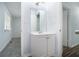 Well-lit bathroom with a white vanity and a view to the bedroom featuring a window and blinds at 2480 Washington Street Ext # 2482, Austell, GA 30106