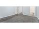 Bedroom with gray carpet and doors to closet and bathroom at 2480 Washington Street Ext # 2482, Austell, GA 30106