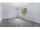 Bedroom featuring gray carpet, light walls, and a bright window at 2480 Washington Street Ext # 2482, Austell, GA 30106