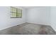 Neutrally decorated bedroom with window and plush gray carpeting at 2480 Washington Street Ext # 2482, Austell, GA 30106
