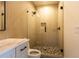 Modern bathroom featuring a glass shower, beautiful tile work, stylish fixtures, and a pebble tile shower floor at 344 Michael Dr, Alpharetta, GA 30009