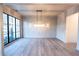 An elegant dining room featuring hardwood floors, stylish light fixtures, and large windows for an open, airy feel at 344 Michael Dr, Alpharetta, GA 30009