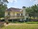 Back of a house with wooden deck overlooking the yard and green trees at 5619 Wandering Vine Se Ln, Mableton, GA 30126