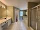 Large primary bathroom with double vanity, soaking tub and separate shower at 5619 Wandering Vine Se Ln, Mableton, GA 30126