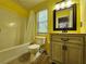 Full bathroom with large vanity, sink, and a tub with shower at 5619 Wandering Vine Se Ln, Mableton, GA 30126