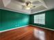 Spacious bedroom with tray ceilings, ceiling fan and hardwood floors at 5619 Wandering Vine Se Ln, Mableton, GA 30126