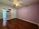 Well-lit bedroom featuring a modern ceiling fan and hardwood flooring at 5619 Wandering Vine Se Ln, Mableton, GA 30126