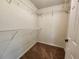 Walk-in closet featuring carpeted flooring and ventilated wire shelving at 5619 Wandering Vine Se Ln, Mableton, GA 30126