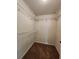Walk-in closet featuring carpeted flooring and ventilated wire shelving at 5619 Wandering Vine Se Ln, Mableton, GA 30126
