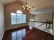 Sun-filled dining room featuring hardwood floors and an elegant chandelier at 5619 Wandering Vine Se Ln, Mableton, GA 30126
