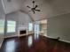 Open living room with beautiful hardwood floors, fireplace and large windows at 5619 Wandering Vine Se Ln, Mableton, GA 30126