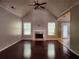 Bright living room featuring a fireplace, high ceilings and dark hardwood floors at 5619 Wandering Vine Se Ln, Mableton, GA 30126