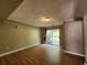 Cozy bonus room with laminate floors and sliding doors at 5619 Wandering Vine Se Ln, Mableton, GA 30126
