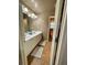 Bright bathroom featuring a double sink vanity, ample lighting, and tile flooring for a clean and modern look at 1517 Gilstrap Nw Ln, Atlanta, GA 30318