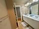 Bathroom featuring double sinks with neutral countertops and decor at 1517 Gilstrap Nw Ln, Atlanta, GA 30318