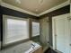 Well-lit bathroom featuring a soaking tub and separate glass-enclosed shower at 1517 Gilstrap Nw Ln, Atlanta, GA 30318