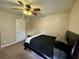 Bedroom with a black bed frame, carpet, and ceiling fan at 1517 Gilstrap Nw Ln, Atlanta, GA 30318