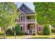Charming two-story home with a cozy front porch and beautifully landscaped front yard at 1517 Gilstrap Nw Ln, Atlanta, GA 30318