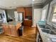 Spacious kitchen features granite countertops, stainless steel appliances, and hardwood flooring at 1517 Gilstrap Nw Ln, Atlanta, GA 30318