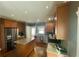 Spacious kitchen features granite countertops, stainless steel appliances, and hardwood flooring at 1517 Gilstrap Nw Ln, Atlanta, GA 30318