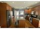 Spacious kitchen features granite countertops, stainless steel appliances, and hardwood flooring at 1517 Gilstrap Nw Ln, Atlanta, GA 30318