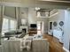 Bright living room with high ceilings, fireplace and large windows showcasing natural light at 1517 Gilstrap Nw Ln, Atlanta, GA 30318