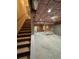Unfinished basement with stairs and exposed ceiling offers customization potential at 1713 Cagle Ct, Lawrenceville, GA 30045
