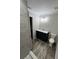 Bathroom features a stylish vanity, toilet, and a glass-enclosed shower with gray tiled walls at 1713 Cagle Ct, Lawrenceville, GA 30045